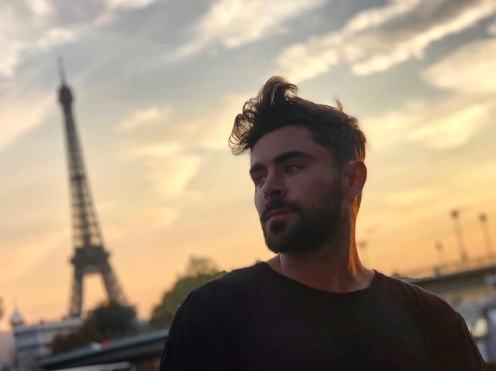 Feast your eyes on the latest iteration of Zac Efron’s beard/overall manliness