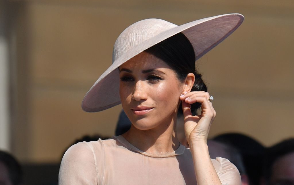 The Internet is FREAKING over these hidden details in Meghan Markle’s coat of arms